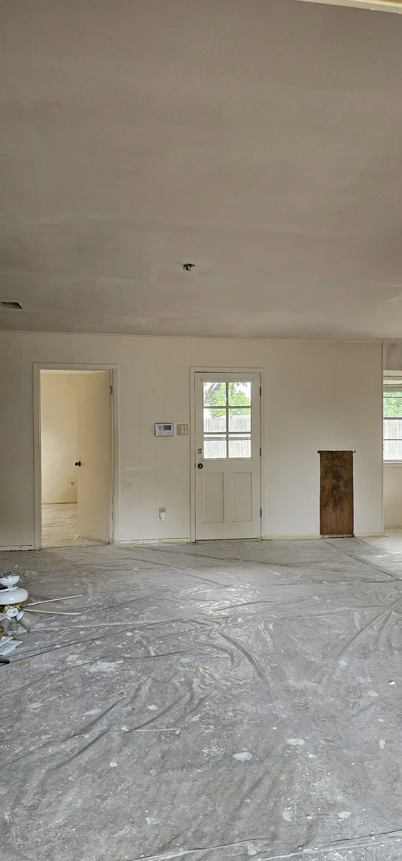 Living room during popcorn ceiling removal