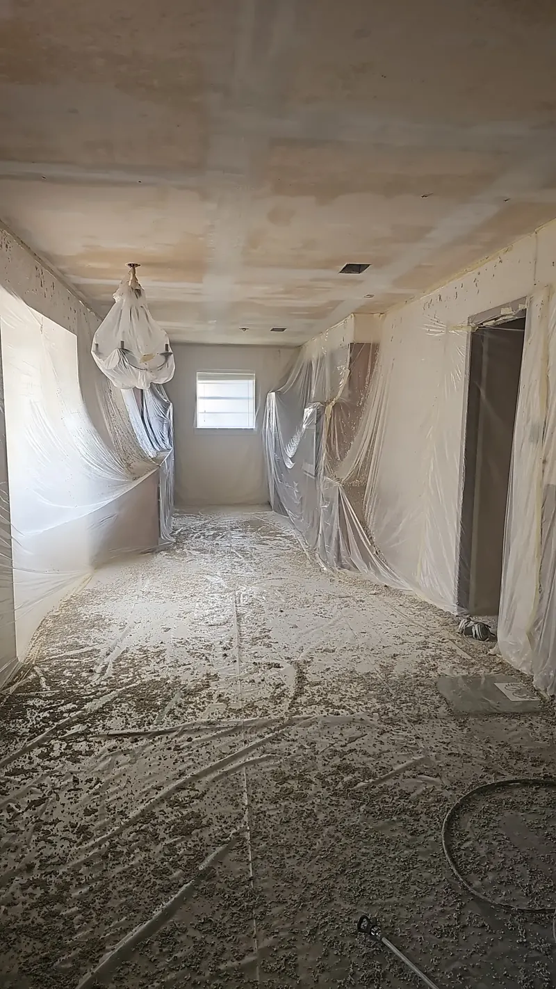 Protected room prepared for popcorn ceiling removal
