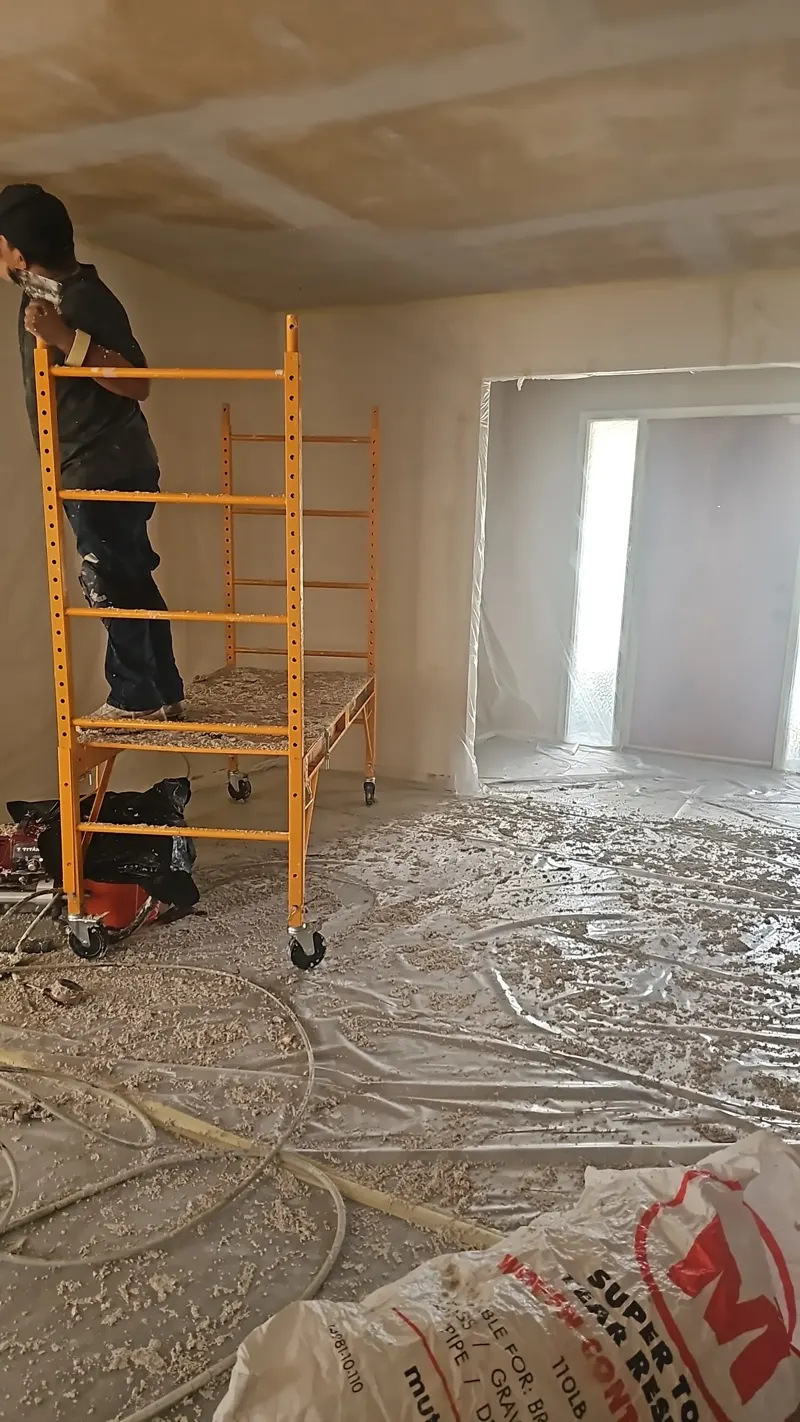 Popcorn ceiling scraping in progress
