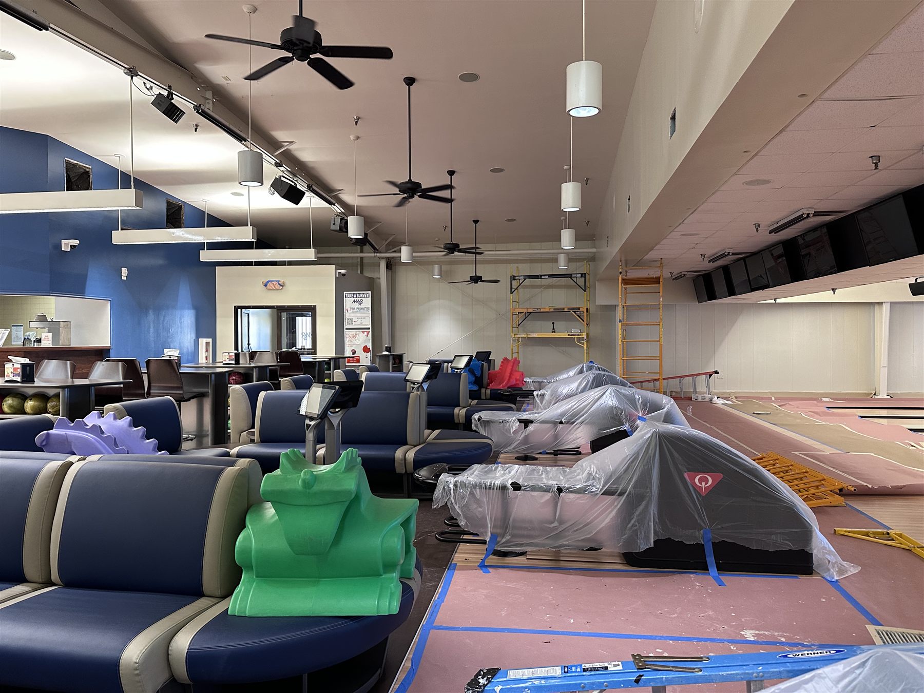 Commercial interior painting project with protected floors and fixtures