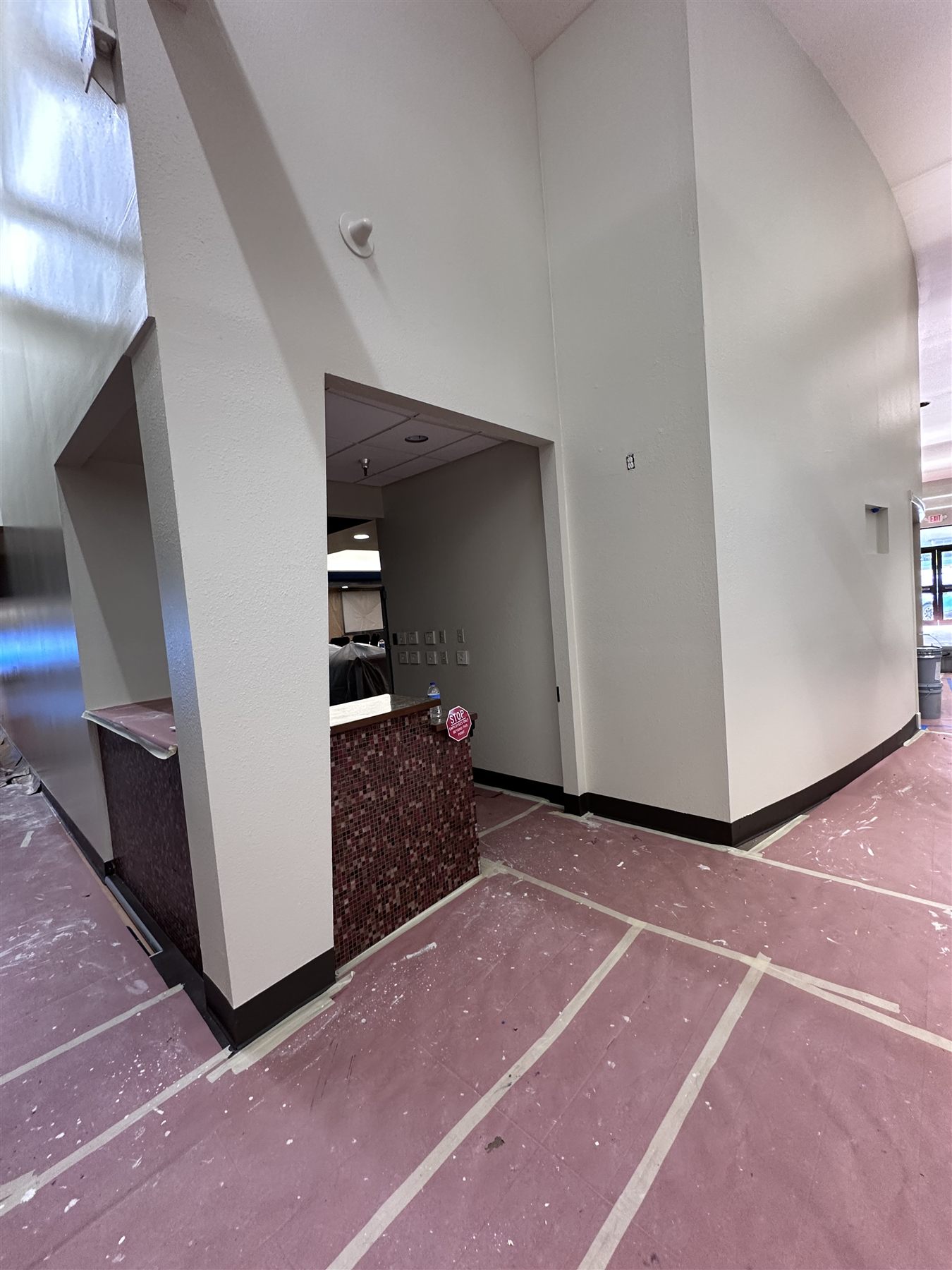 Commercial wall painting preparation with masked surfaces in DFW